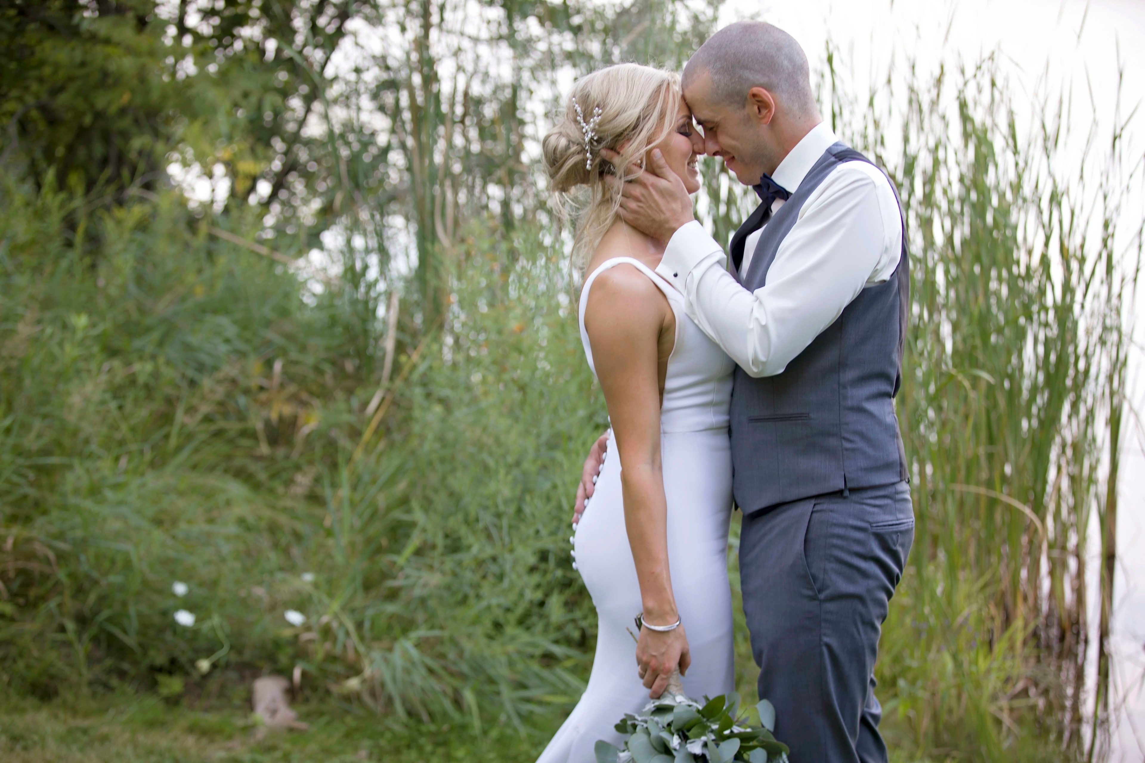The wedding ring, Heart to heart photography, Thorold wedding photographer, wedding photographer, bride and groom kissing amongst trees