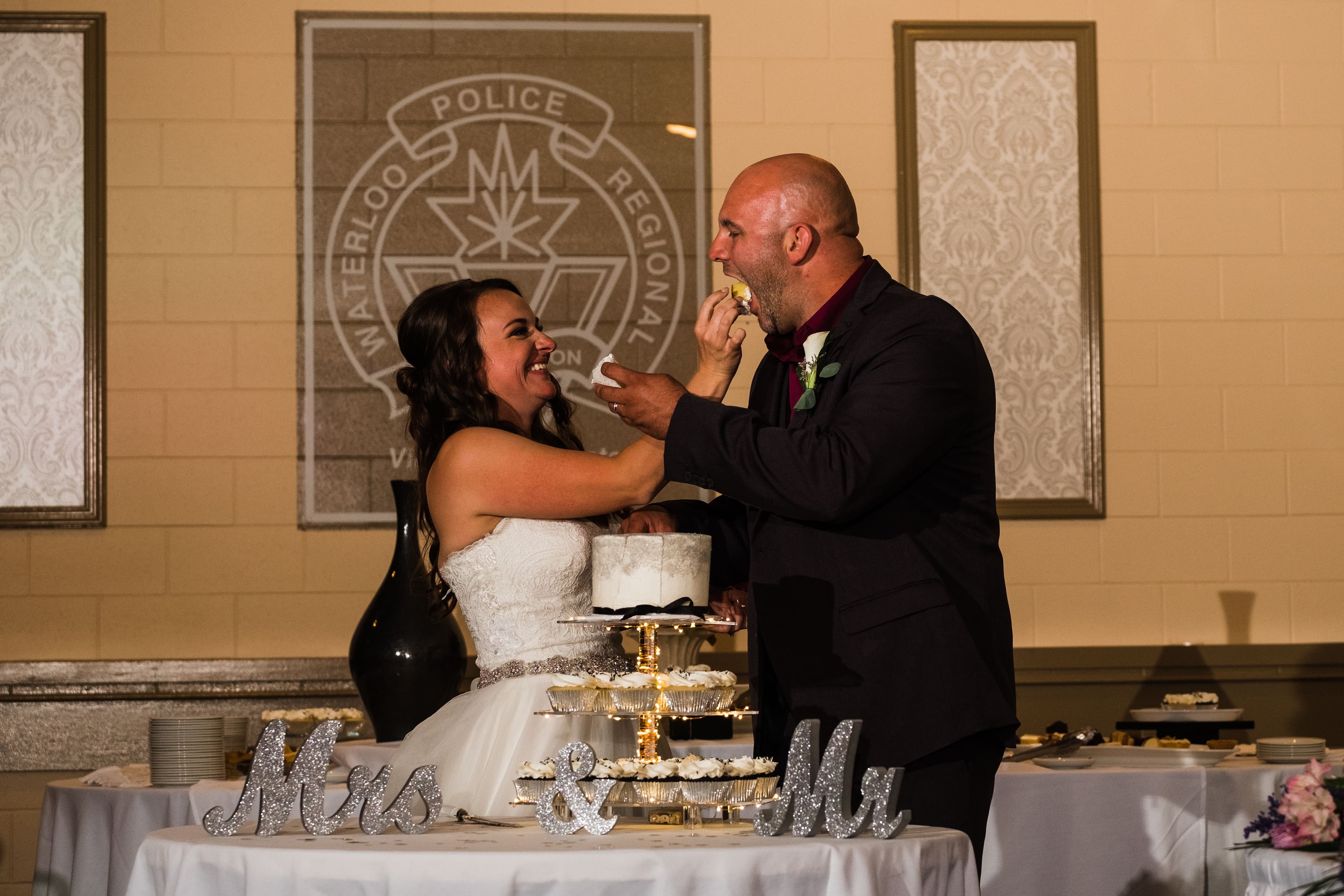 The wedding ring, Waterloo Regional Police Association, BMKH Photography, KW wedding photographer, Waterloo wedding venue, Kitchener wedding venue, Cambridge wedding venue, wedding decor, bride and groom feeding each other wedding cake