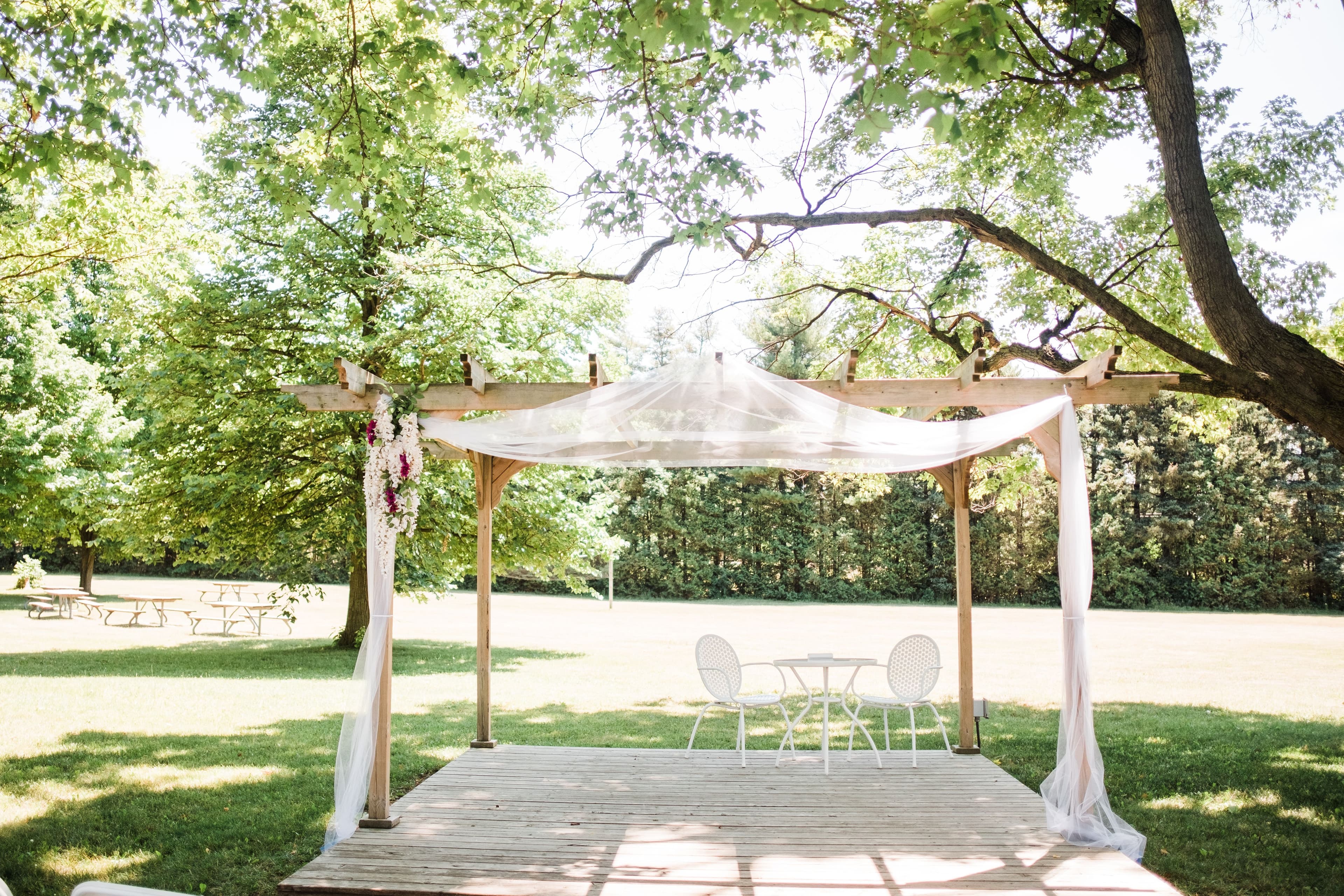 The wedding ring, Waterloo Regional Police Association, BMKH Photography, KW wedding photographer, Waterloo wedding venue, Kitchener wedding venue, Cambridge wedding venue, wedding decor, wedding decor, wedding arch outside in the trees
