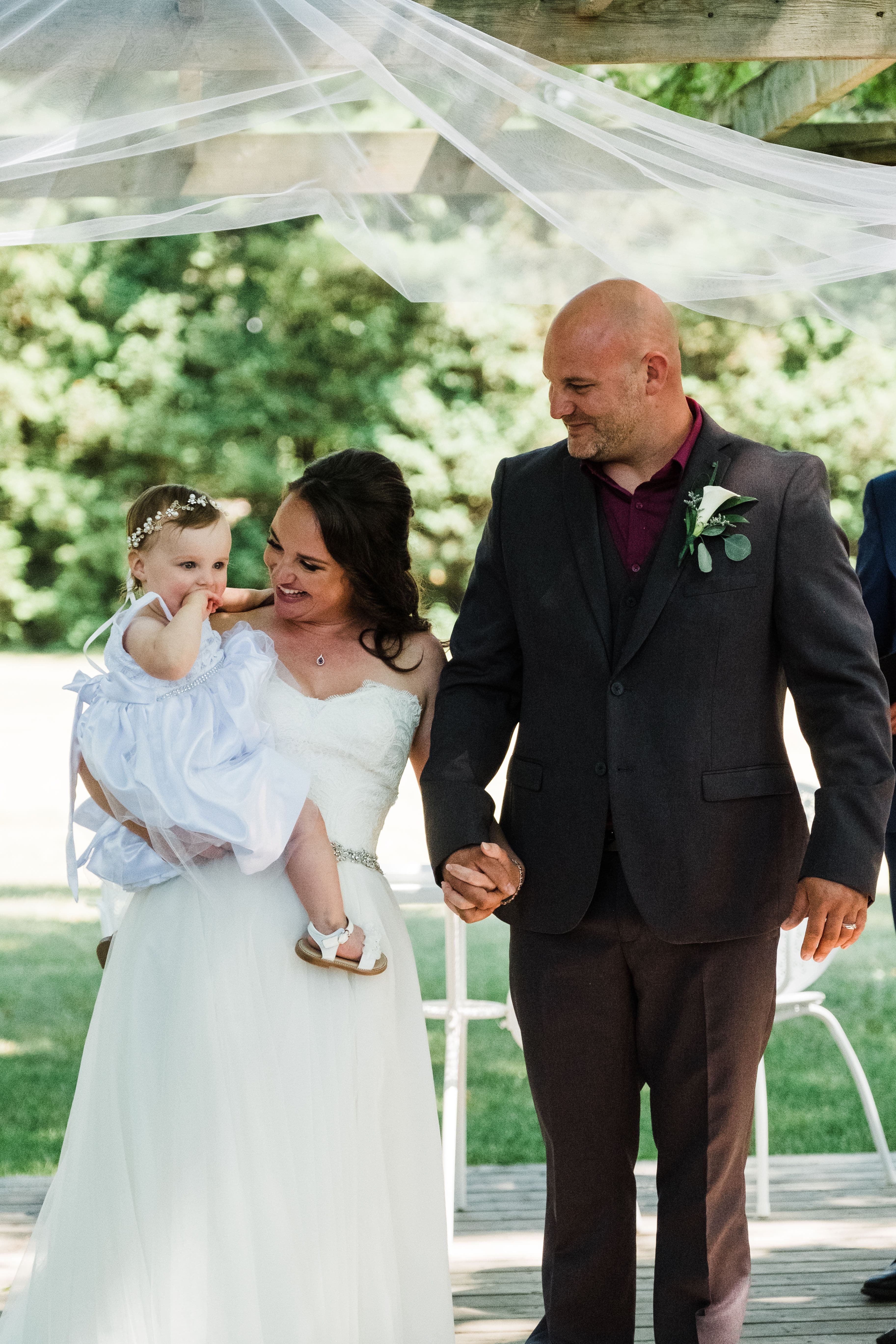 The wedding ring, Waterloo Regional Police Association, BMKH Photography, KW wedding photographer, Waterloo wedding venue, Kitchener wedding venue, Cambridge wedding venue, wedding decor, Bride and groom with daughter walking down aisle after saying I do