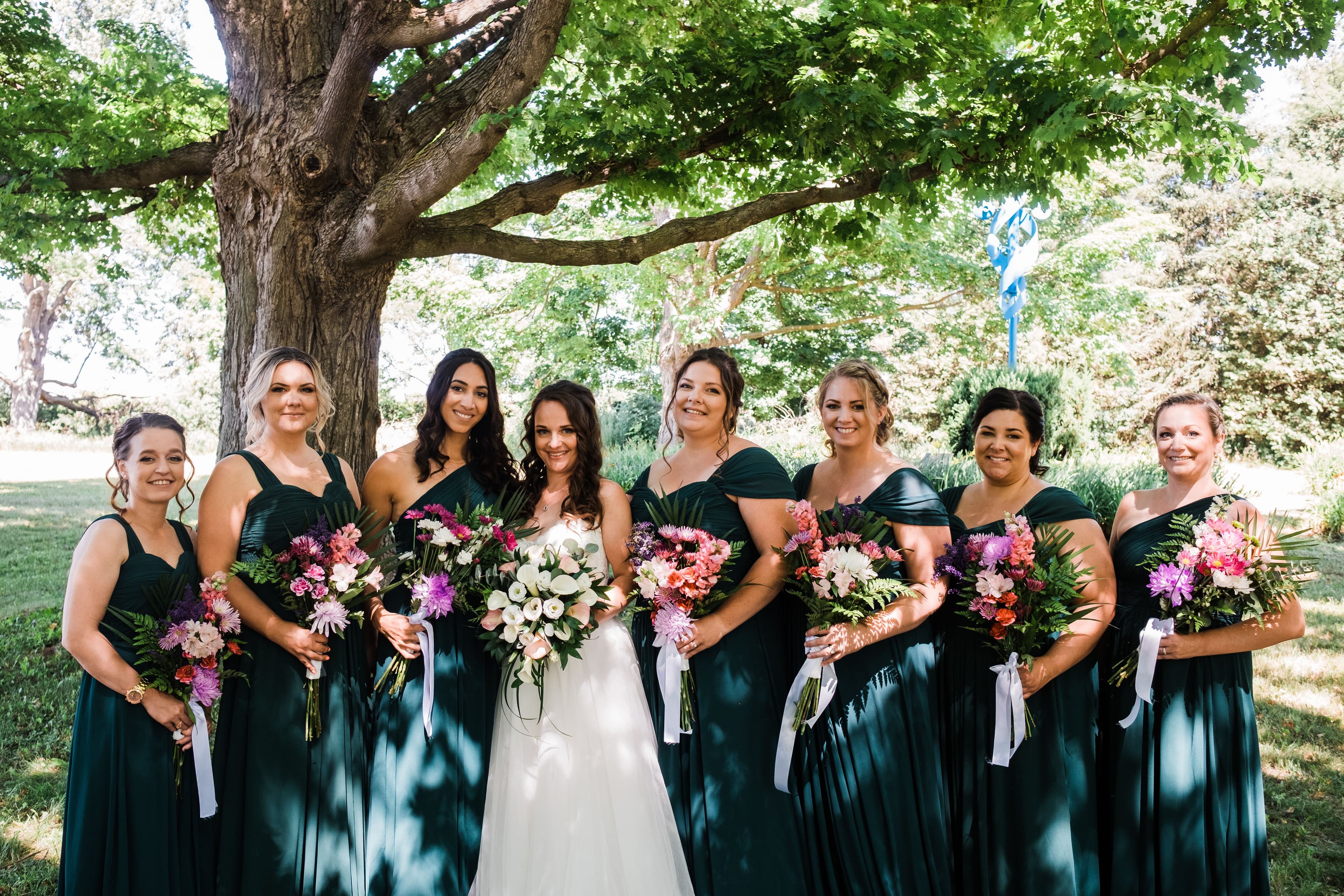 The wedding ring, Waterloo Regional Police Association, BMKH Photography, KW wedding photographer, Waterloo wedding venue, Kitchener wedding venue, Cambridge wedding venue, bride and her bridesmaids standing for a group photo