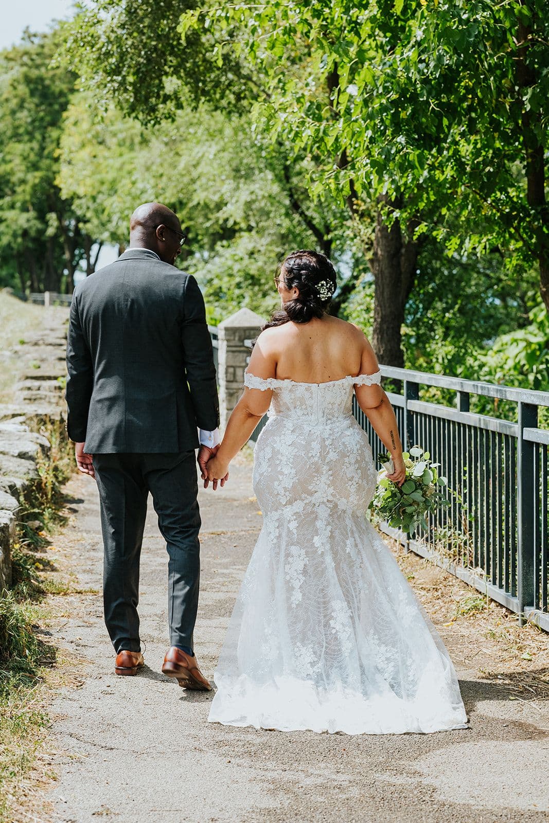 C Hotel by Carmen's, Hamilton wedding venue, Fedora Media, Cambridge wedding photographer, the wedding ring, bride and groom holding hands walking away from the camera looking at each other