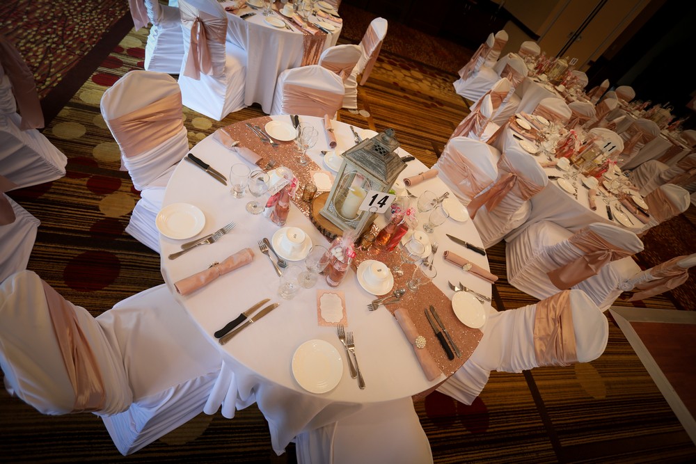 Soft and romantic neutral wedding decor in white and rose gold