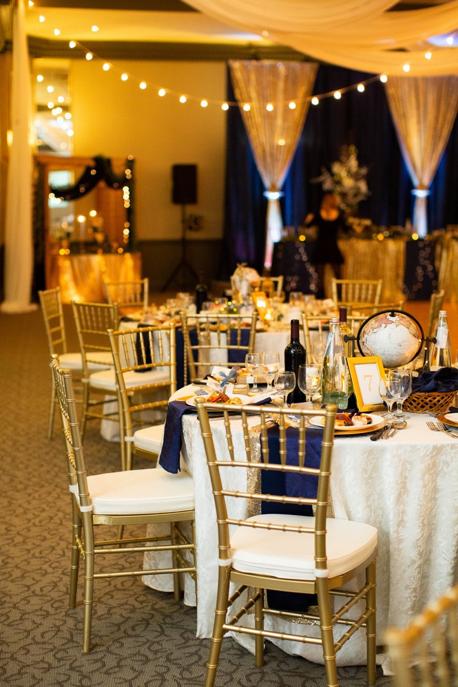 neutral wedding decor with a pop of navy blue and gorgeous chivari chairs