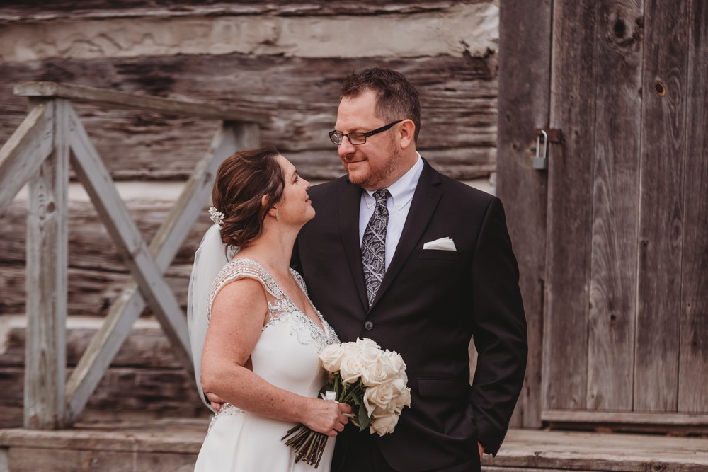 understated elegance at Delta Waterloo, bride and groom against wood wall