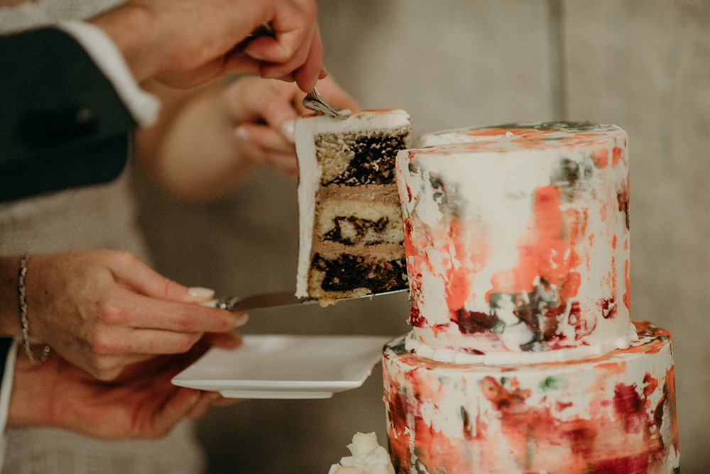 couple cutting wedding cake