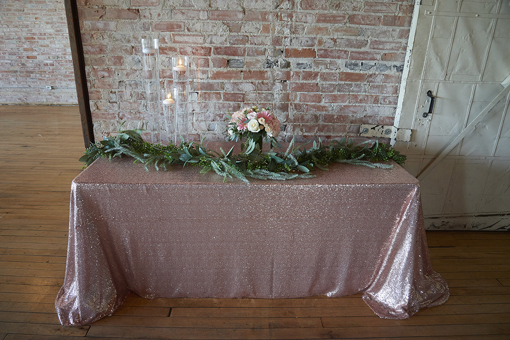 rose coloured headtable against a brick wall now & always