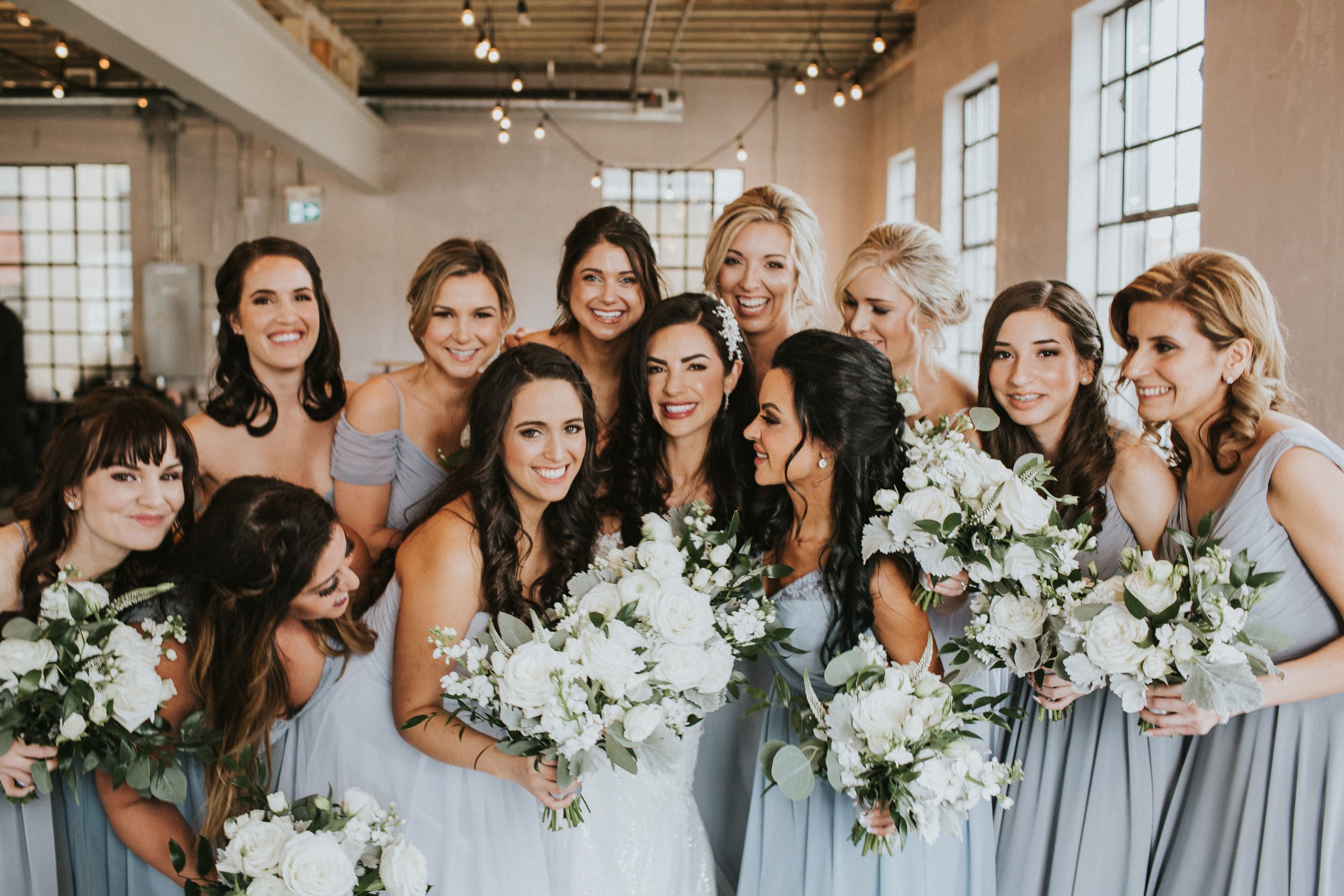 The Flowers are Still Blooming La Petite Fleur Solet Photography Bride with bridesmaids with stunning white bouquets