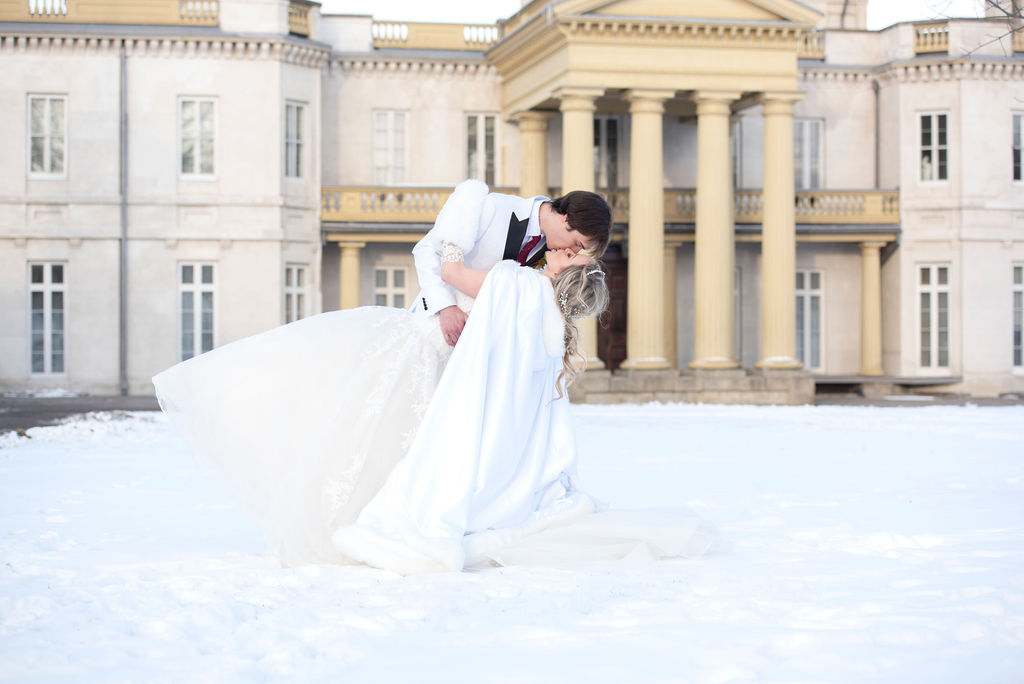 Winter White Wedding Simple Wedding photography bride and groom kissing in the snow