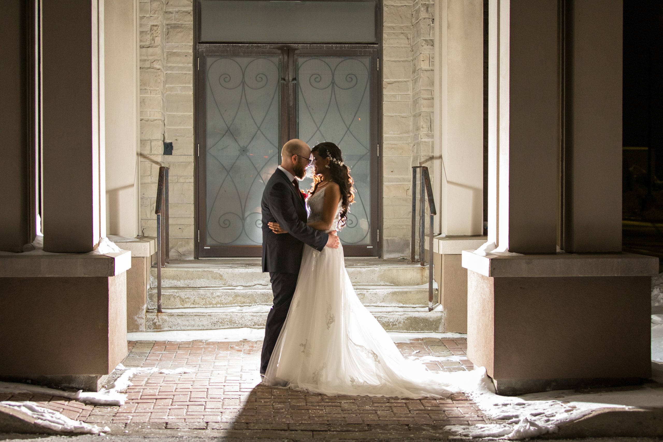 The Wedding Ring, DA Photography, Guelph Ontario Wedding Photographer, Bride and Groom silhouette at night in front of building