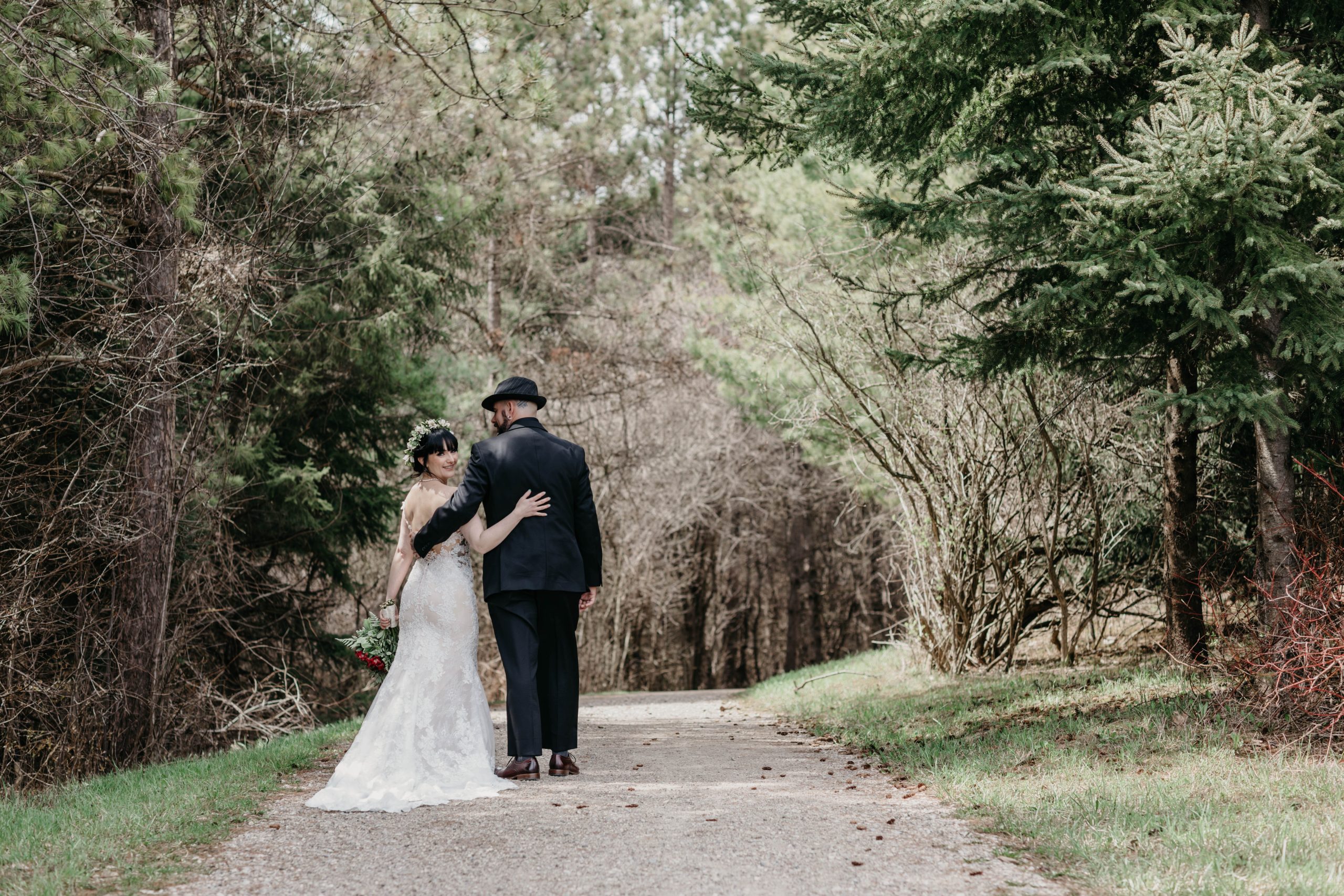 The Wedding Ring, Pine Valley Chalet, Kitchener Waterloo Ontario Events Venue, Timeless Tree Weddings Photography, Bride and Groom Walking in the woods