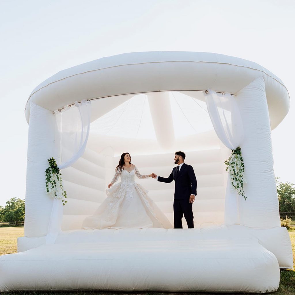 The Wedding Ring, Party Supply Co. Stratford Ontario Rental Supply Company, Bride and Groom in White bouncy castle 