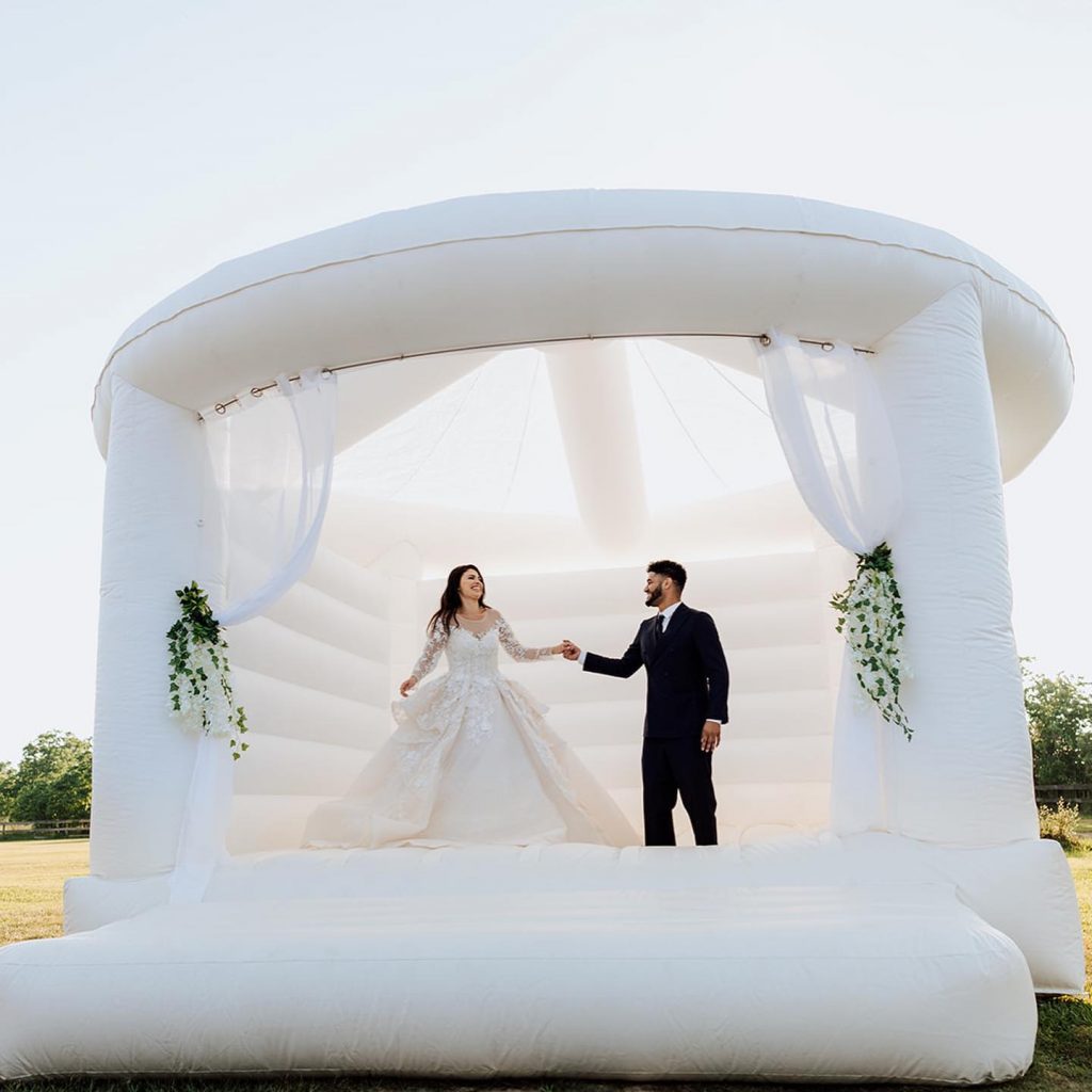 The Wedding Ring, Party Supply Co. Stratford Ontario Rental Supply Company, Bride and Groom in White bouncy castle
