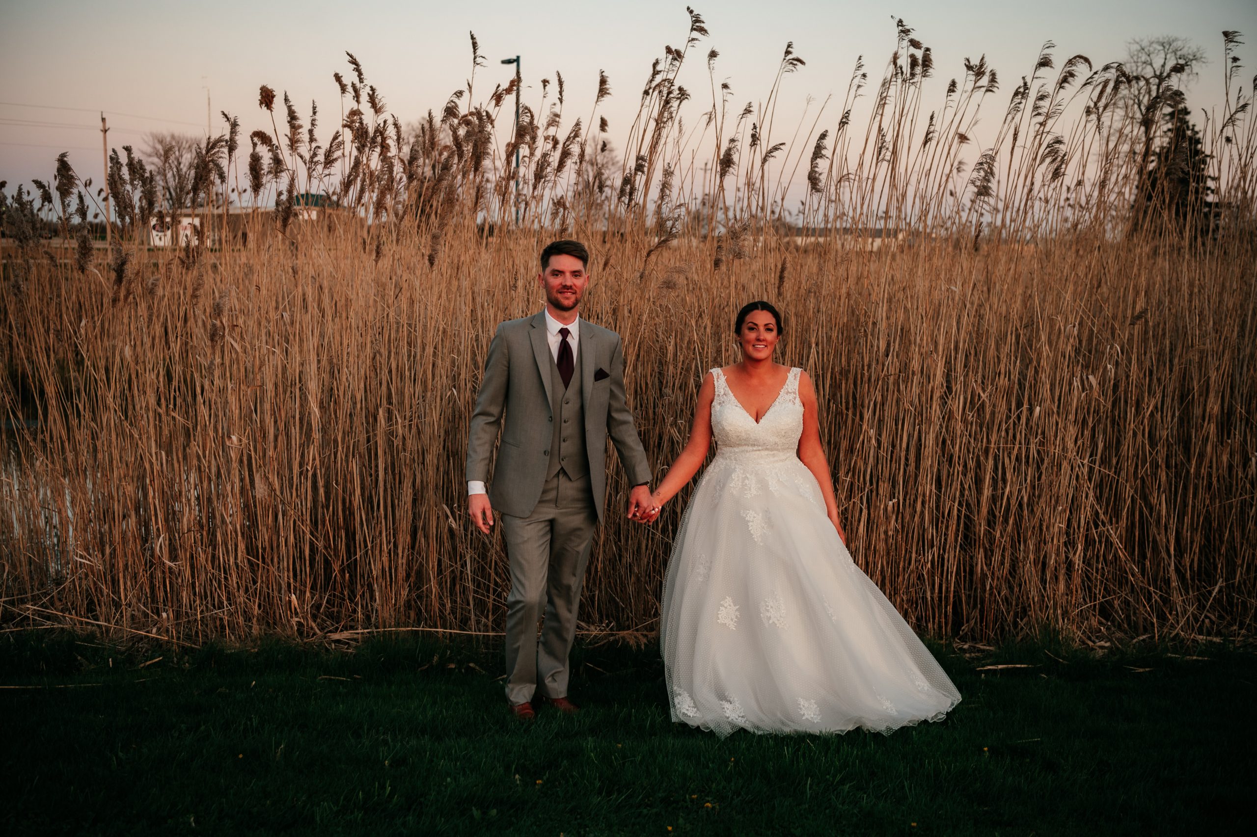 The Wedding Ring, Natalie Rose Photography, London Ontario Wedding Photographer, Best Western PLUS Stoneridge Inn, London event venue, Bride and Groom in tall grass at sunset