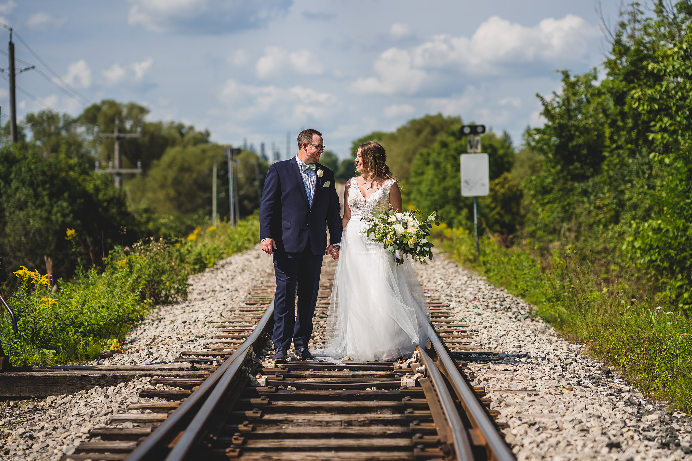 The Wedding Ring, Gary Evans Photography, Kitchener Waterloo Ontario Wedding Photographer, Cellar52, St.Jacobs Ontario event venue, Bride and Groom walking on train tracks