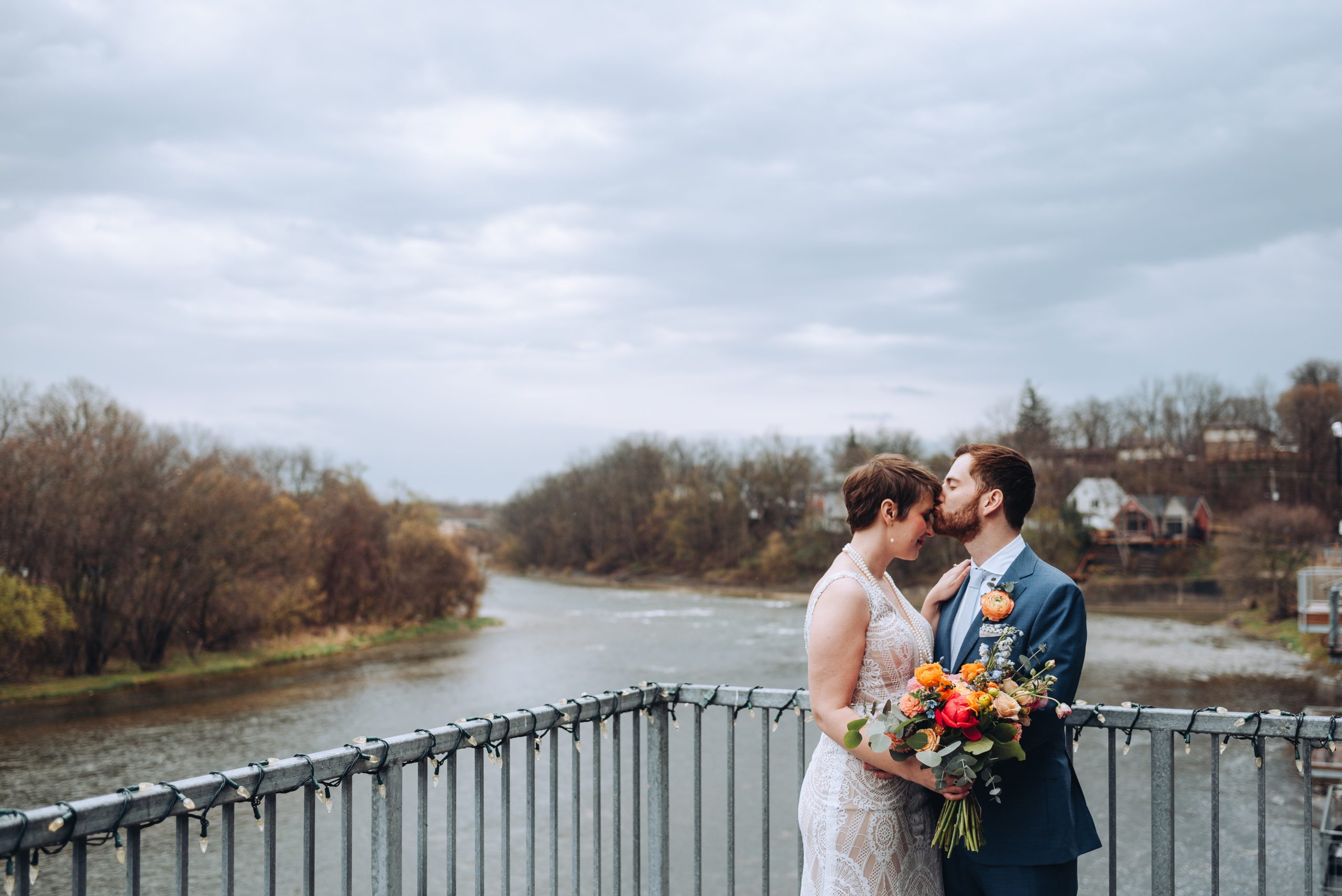 The Wedding Ring, Now & Always Special Event Decor, Paris Ontario, Devon C Photography, Kitchener Waterloo Ontario Wedding Photographer, Groom kissing Bride's forehead on balcony overlooking the water