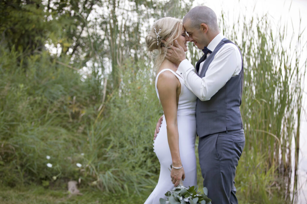 The wedding ring, Heart to heart photography, Thorold wedding photographer, wedding photographer, bride and groom kissing amongst trees