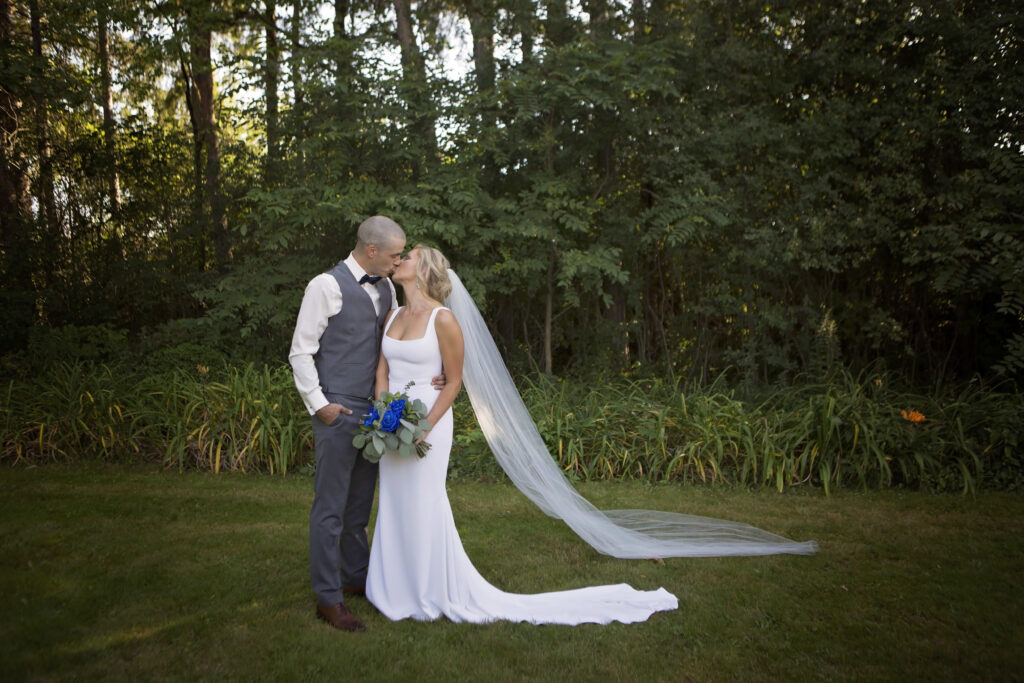 The wedding ring, Heart to heart photography, Thorold wedding photographer, wedding photographer, bride and groom kissing amongst trees