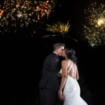 the wedding ring, DA Photography, KW wedding photographer, Edgewater manor, stoney creek wedding venue, bride and groom kissing at night with fireworks in the sky