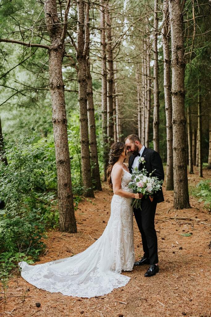 Erin Estates, Wedding Venue, Fedora Media, Cambridge Wedding Photographer, Bride & Groom standing in woods kissing