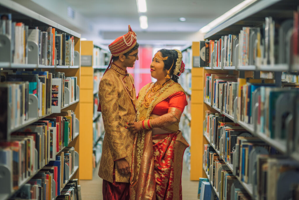 The Wedding Ring, Kitchener Public Library, Peter B Photography, KW wedding photographer, Kitchener wedding venue, Waterloo wedding venue, Cambridge wedding venue, bride and groom in the library aisles surrounded by books
