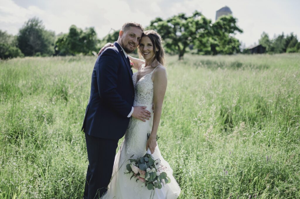 Grey Silo Golf Course, Bride and Groom holding each other looking at the camera