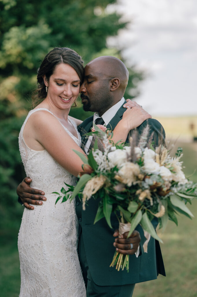 casual boho wedding, elli bell photography, bride and groom hugging and smiling